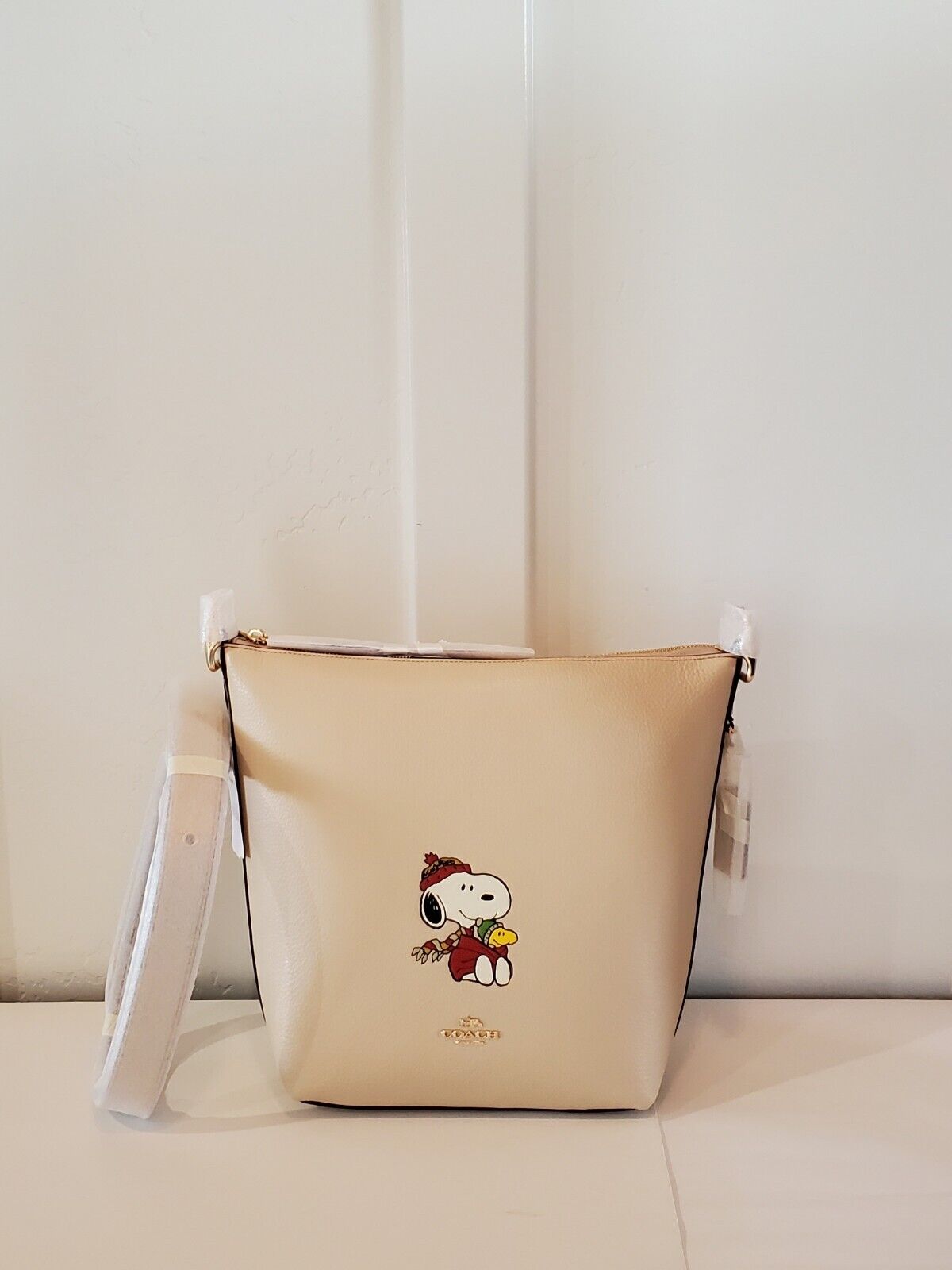 Coach X Peanuts hotsell Mini Jamie Camera Bag With Snoopy Cuddle Motif